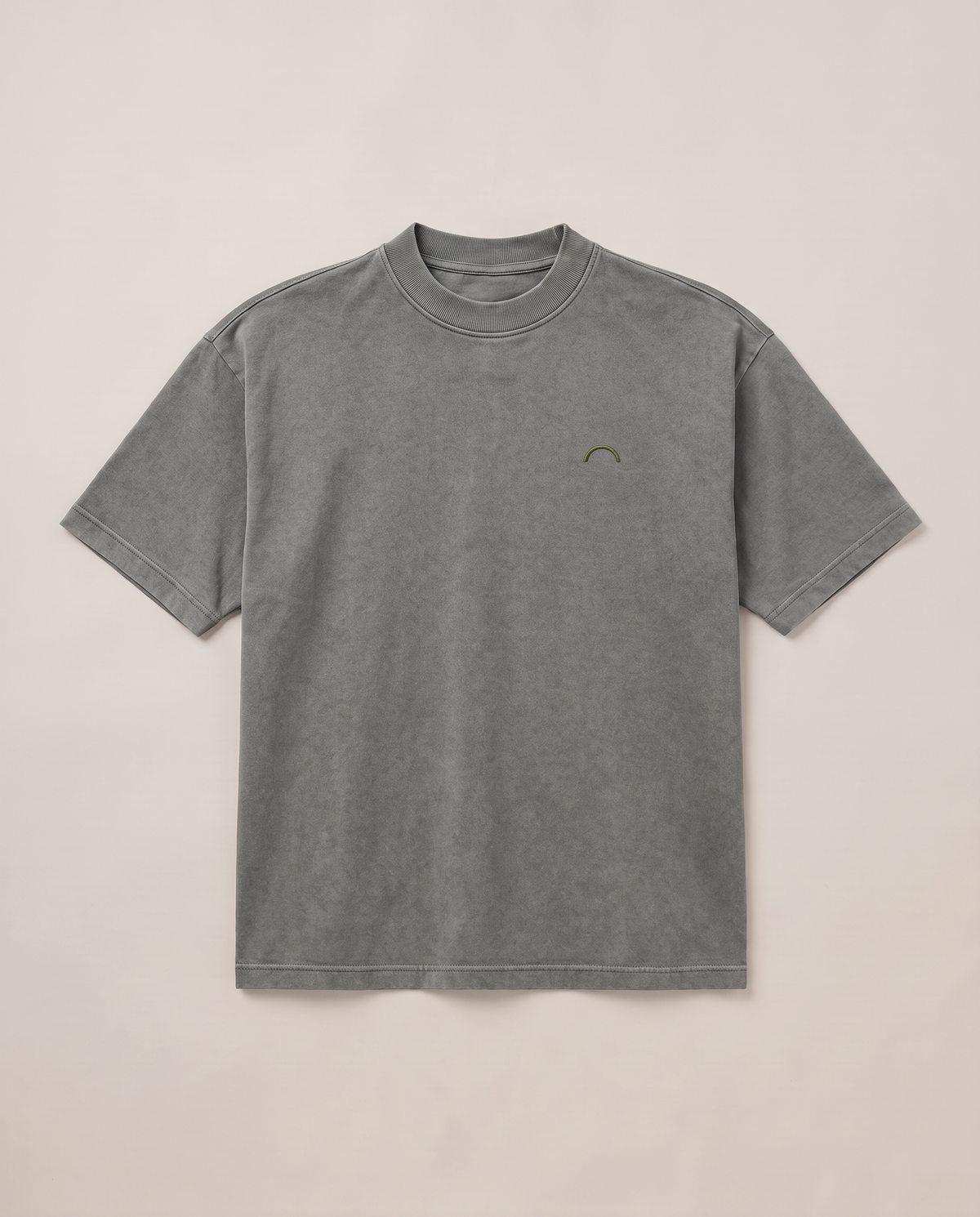 Quiet Arc T-shirt flat lay front in washed graphite with an olive chest arc
