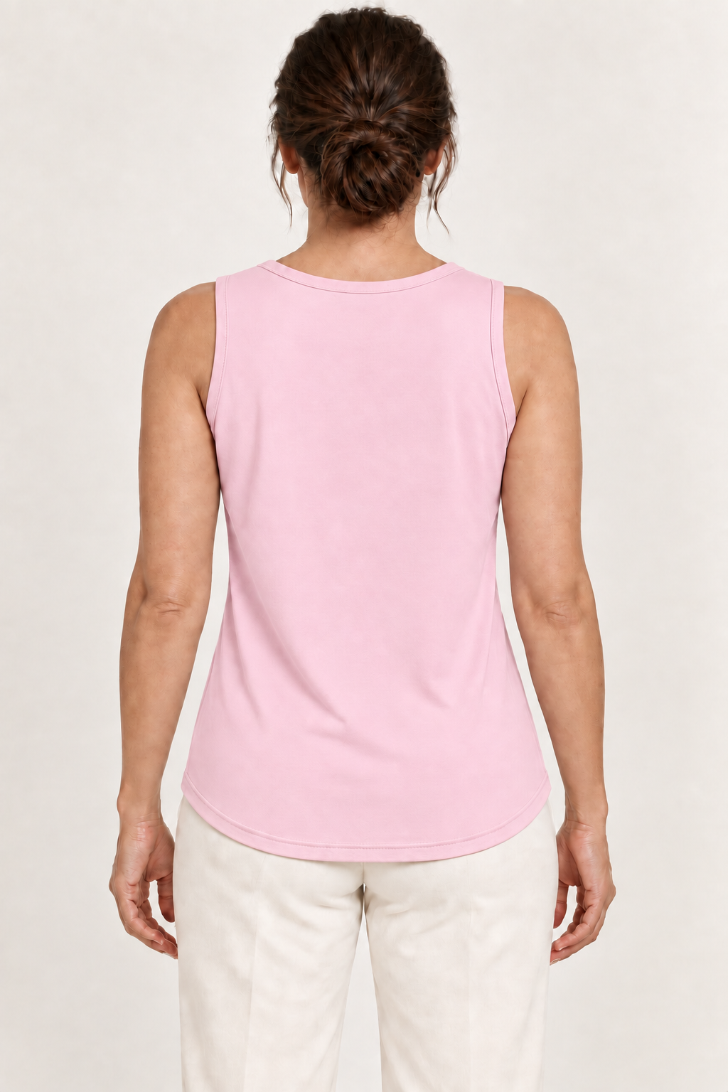Pink cotton-stretch round-neck tank, model back.