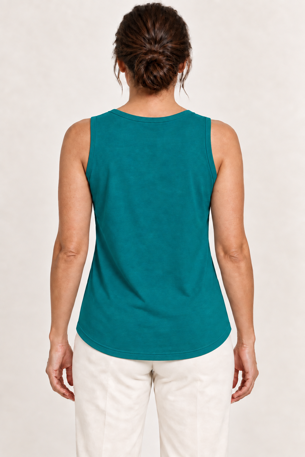 Teal green cotton-stretch round-neck tank, model back.