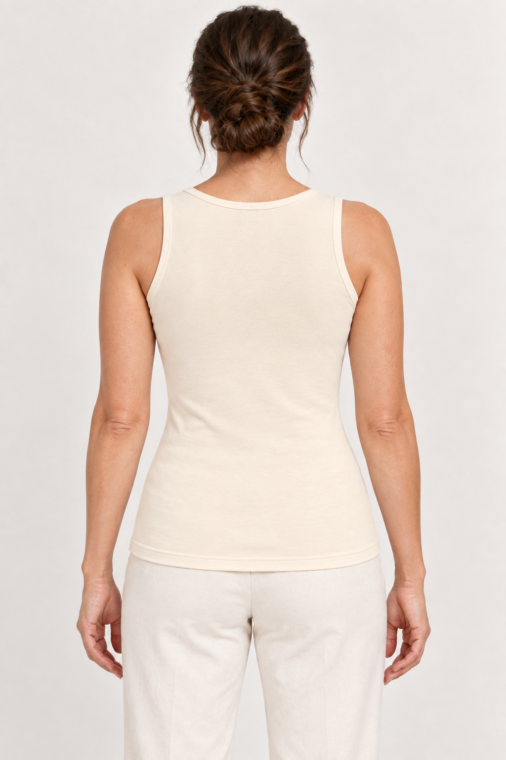 Cream cotton-stretch tank, model back.