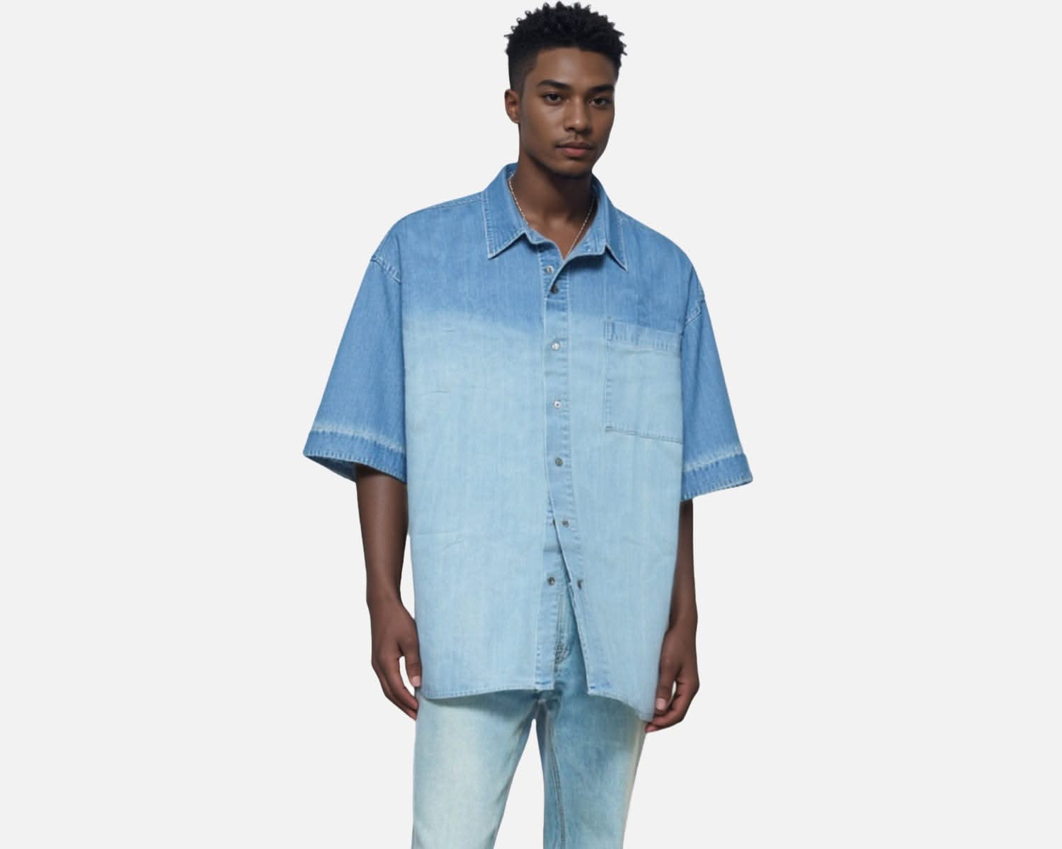 Front angled view of IdyllVie Oversized Denim Shirt styled with light jeans, highlighting its casual fit and chest pocket design.