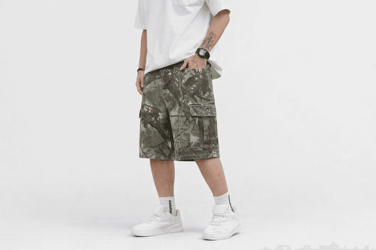 IdyllVie Green Camo Baggy Jorts in Camo shorts foundation on-model front angled with refined IdyllVie styling