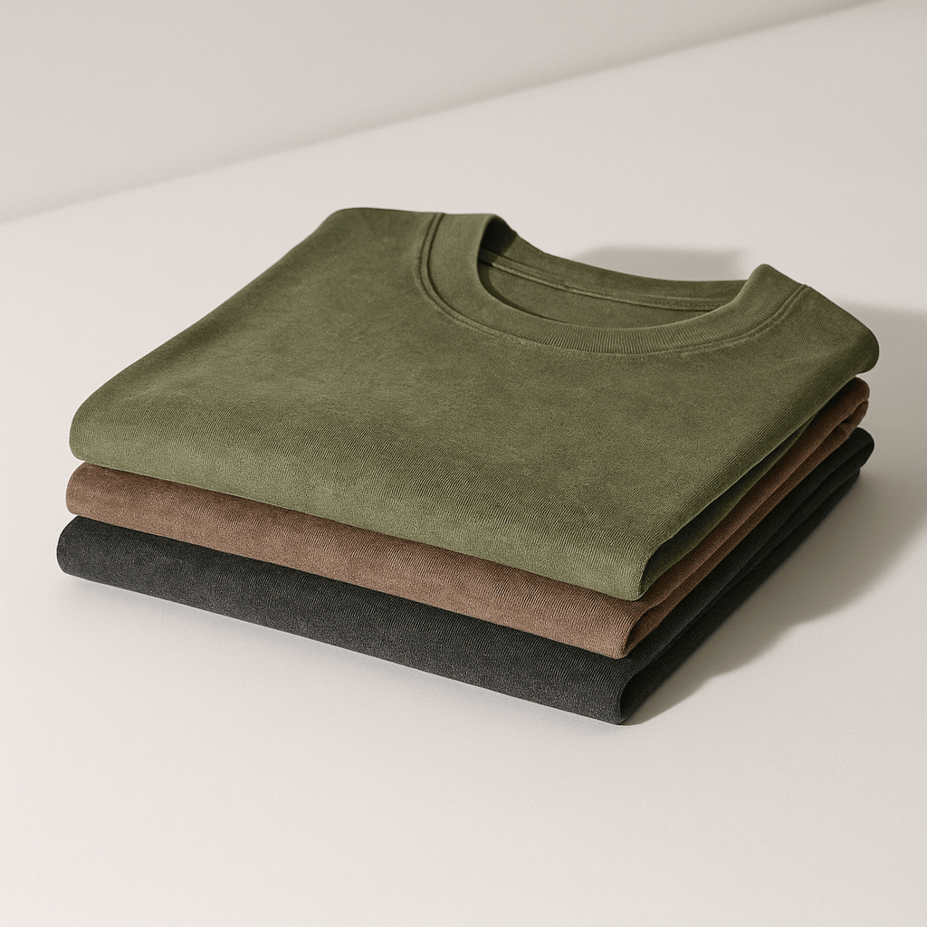 Men's Cotton Tees - 3 Pack Organic | Durable, Soft folded in olive, brown, and black stonewashed colors, showcasing premium fabric texture.