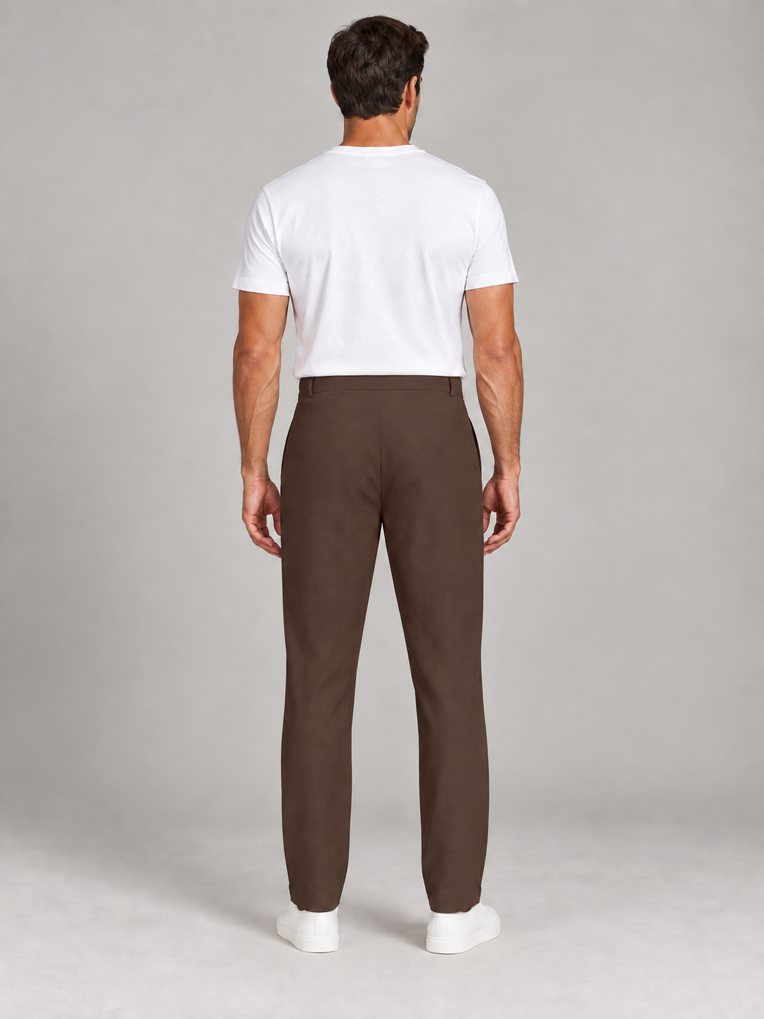Brown drawstring trousers, plain back on a model.