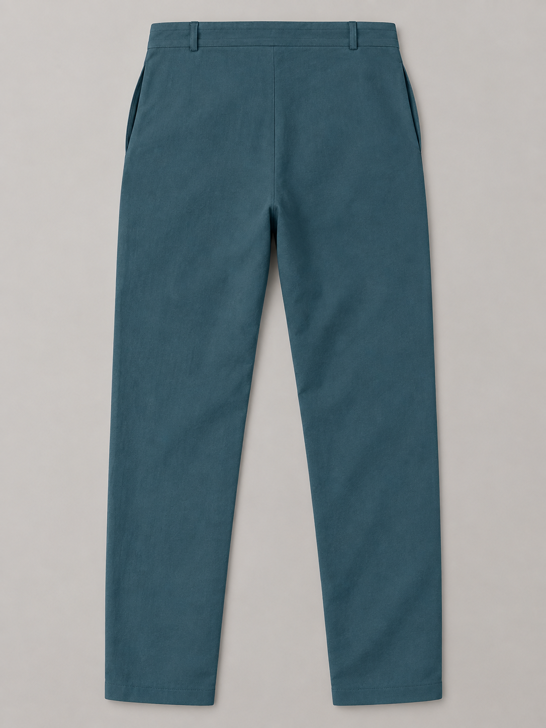 Teal Blue drawstring trousers, flat back with two belt loops and plain hems.