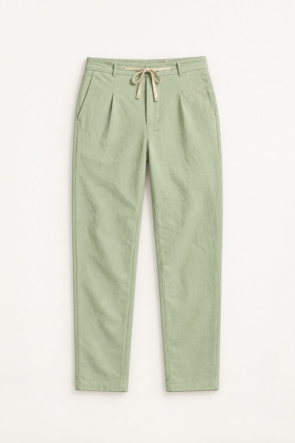 Green cotton pleated drawstring pants, flat lay front.
