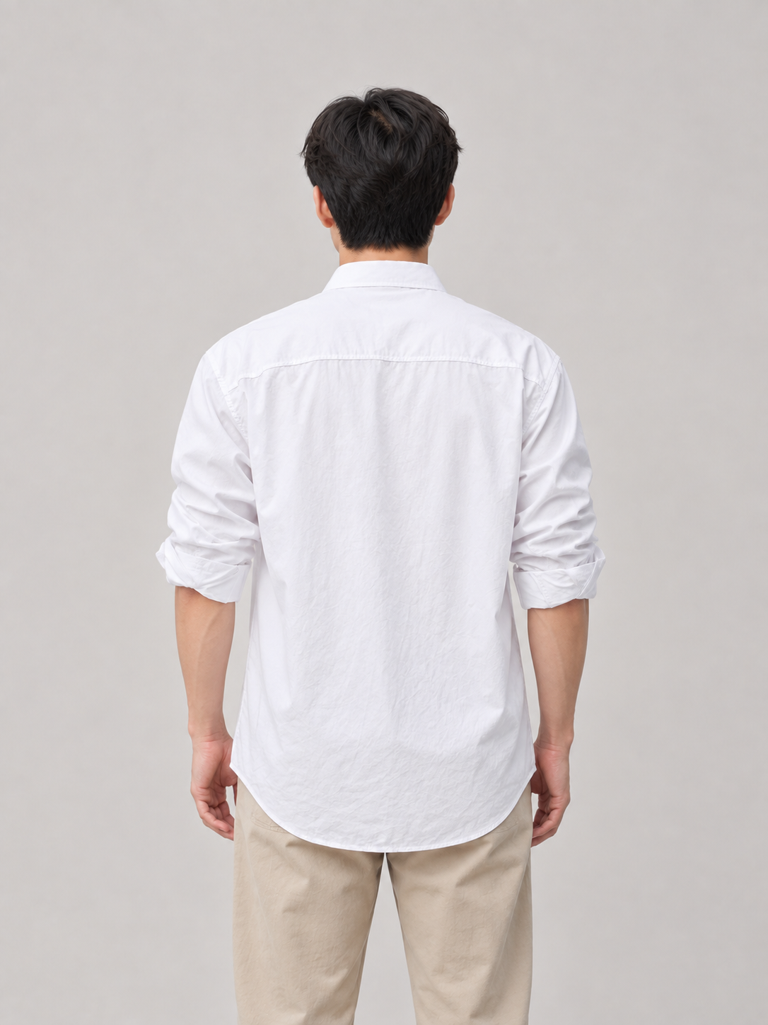 White cotton relaxed pocket shirt, model back.
