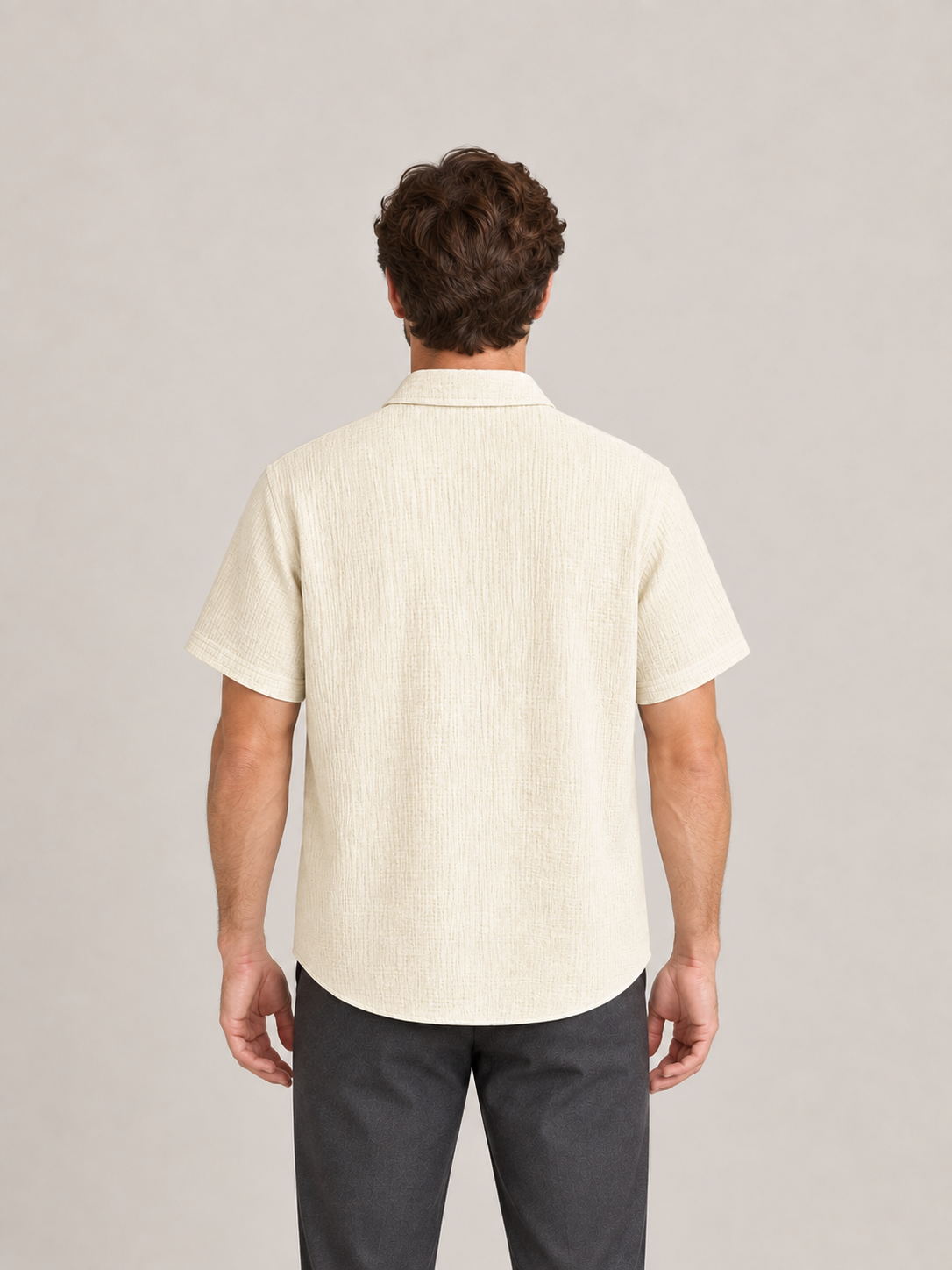Pale khaki textured cotton short-sleeve shirt, model back.