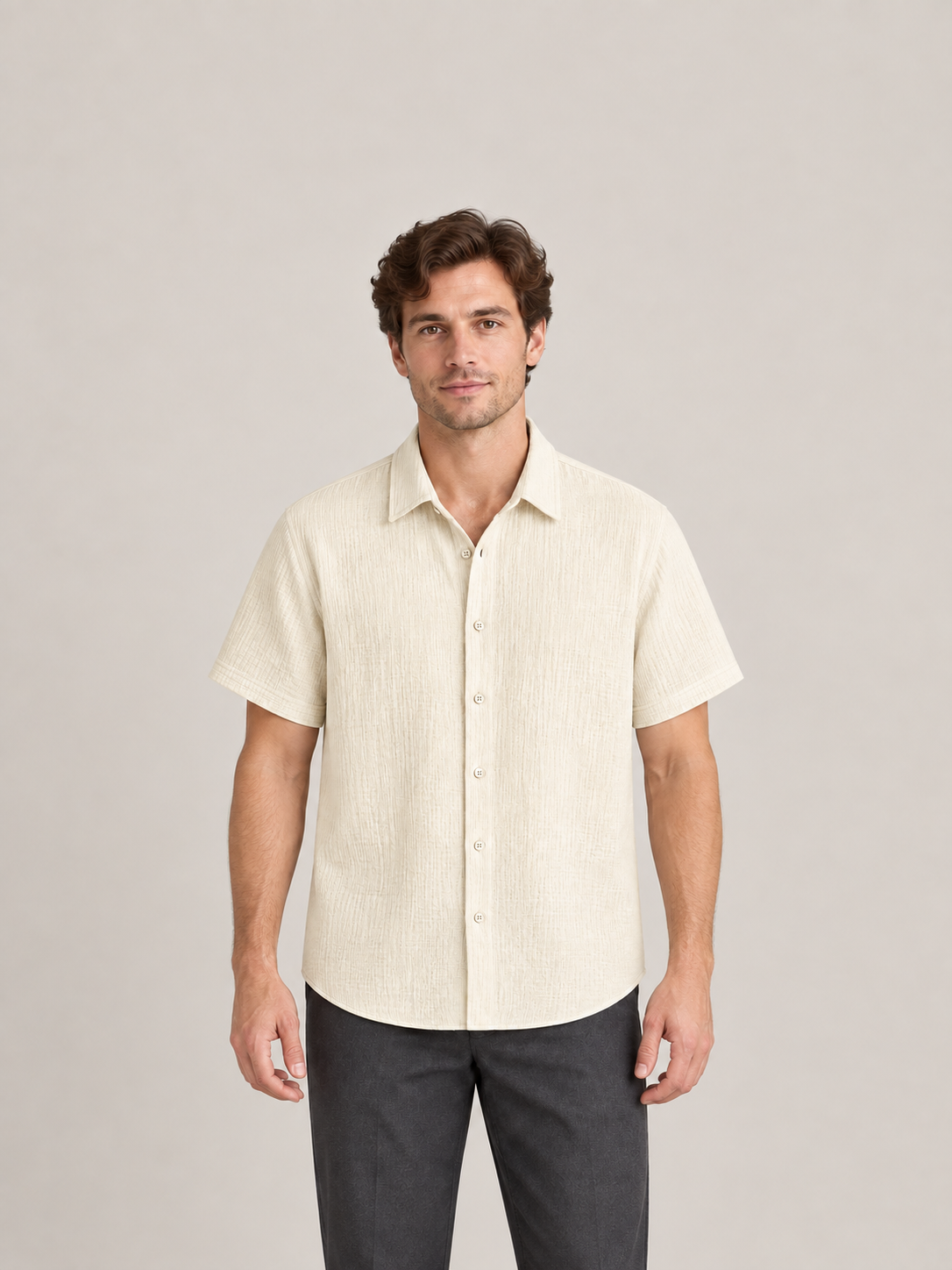 Pale khaki textured cotton short-sleeve shirt, model front.