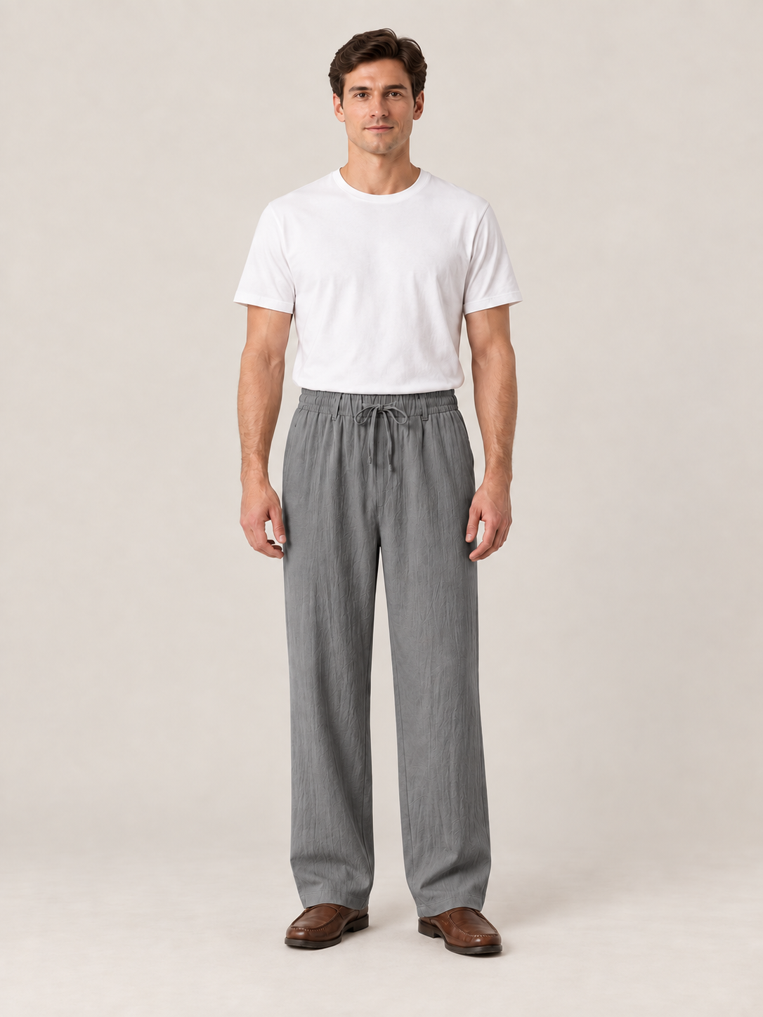 Dark Grey woven drawstring trousers, front view on a model.
