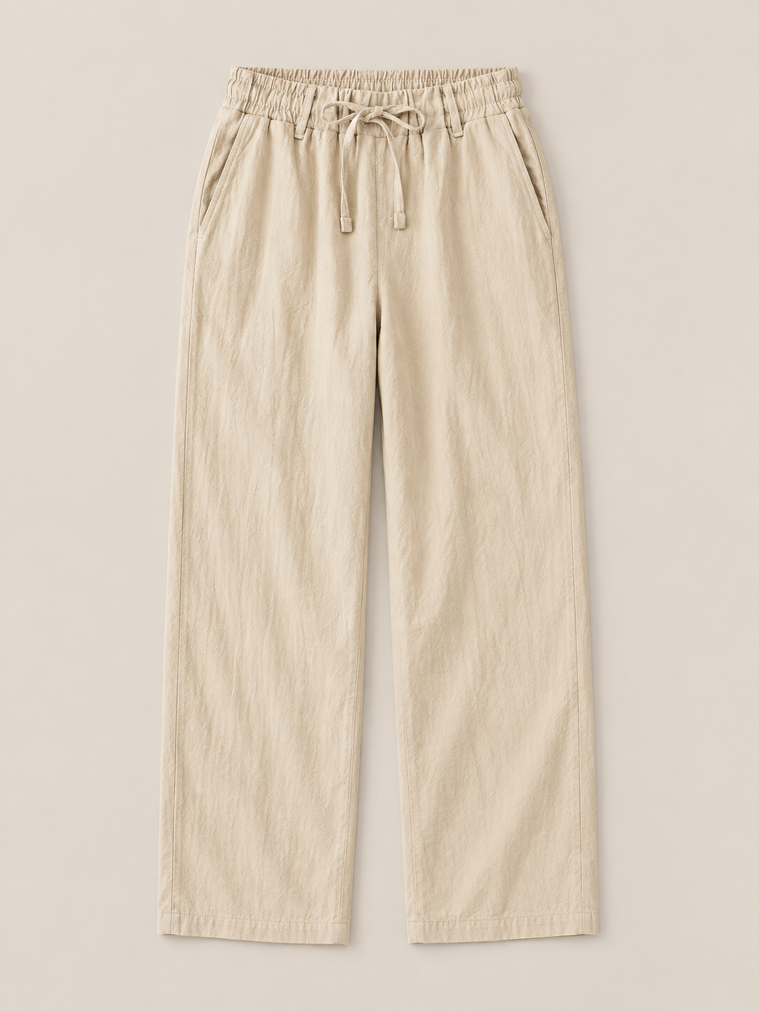 Khaki woven drawstring trousers, flat front with drawstring waist and side pockets.