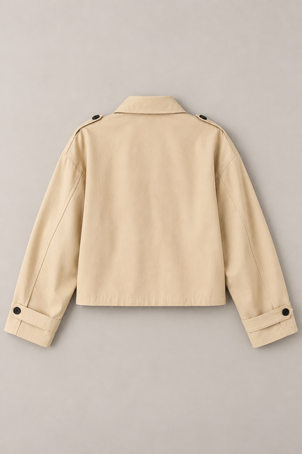 Camel cotton buckle-collar jacket, flat back showing plain panel and folded collar.
