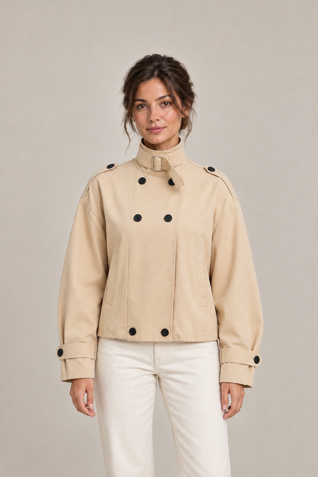 Camel cotton buckle-collar jacket, front on a model showing six-button fastening and welt pockets.