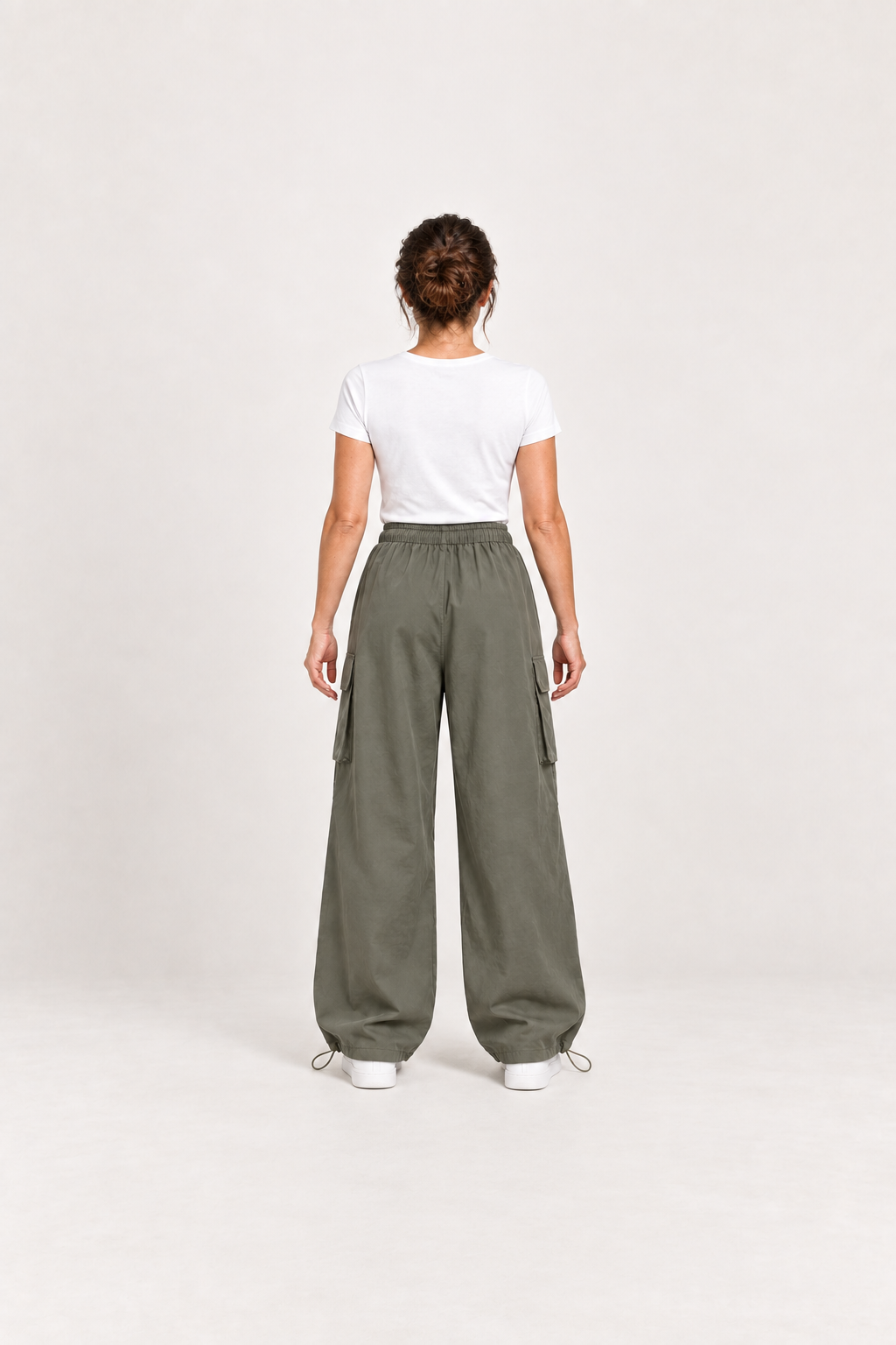 Green cotton cargo pants, model back.