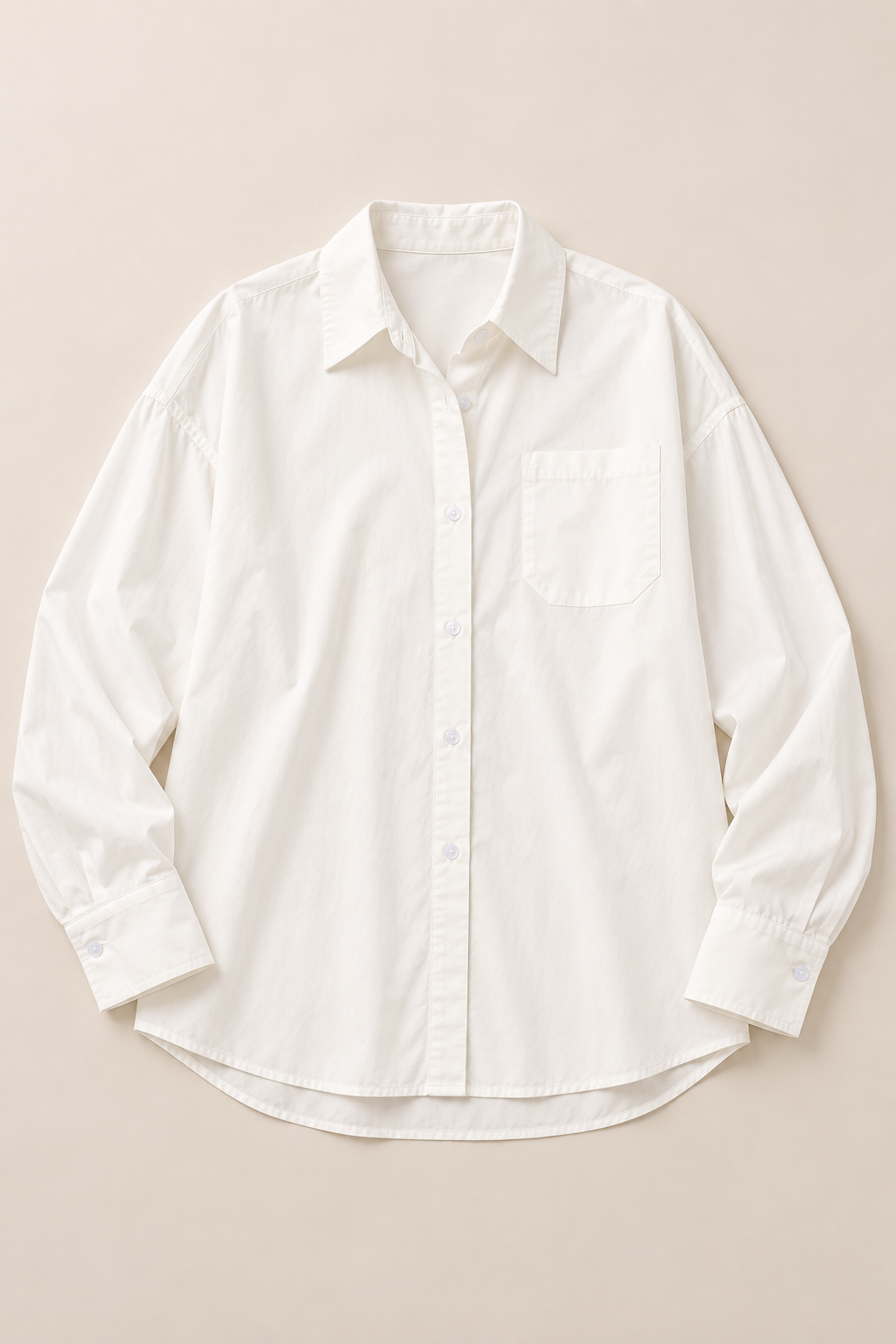 White cotton button-front shirt shown flat, with pointed collar and one chest pocket.
