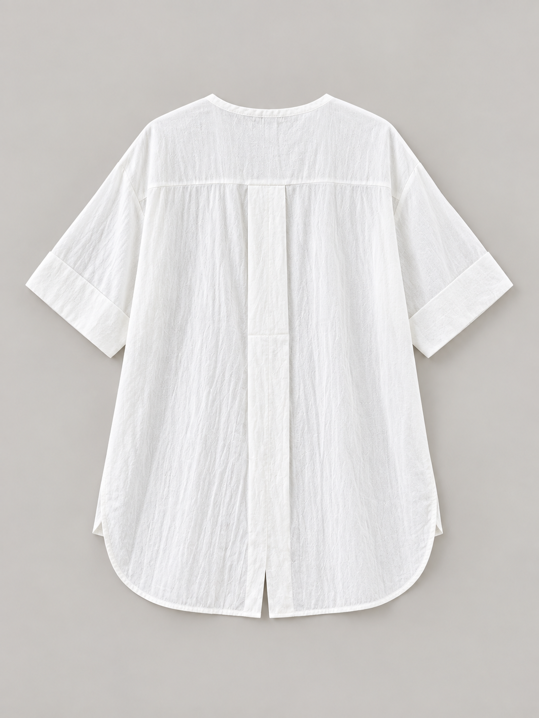 White cotton Henley popover with back pleat, flat lay back.
