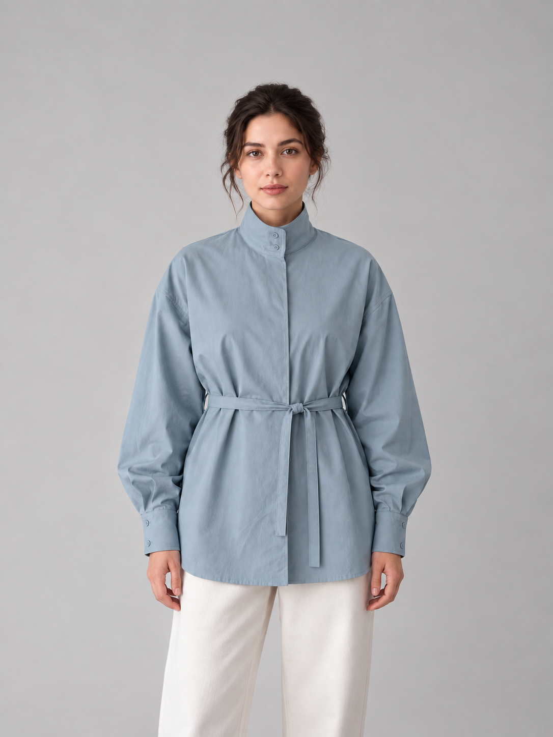 Blue stand-collar tie-waist shirt, model front.