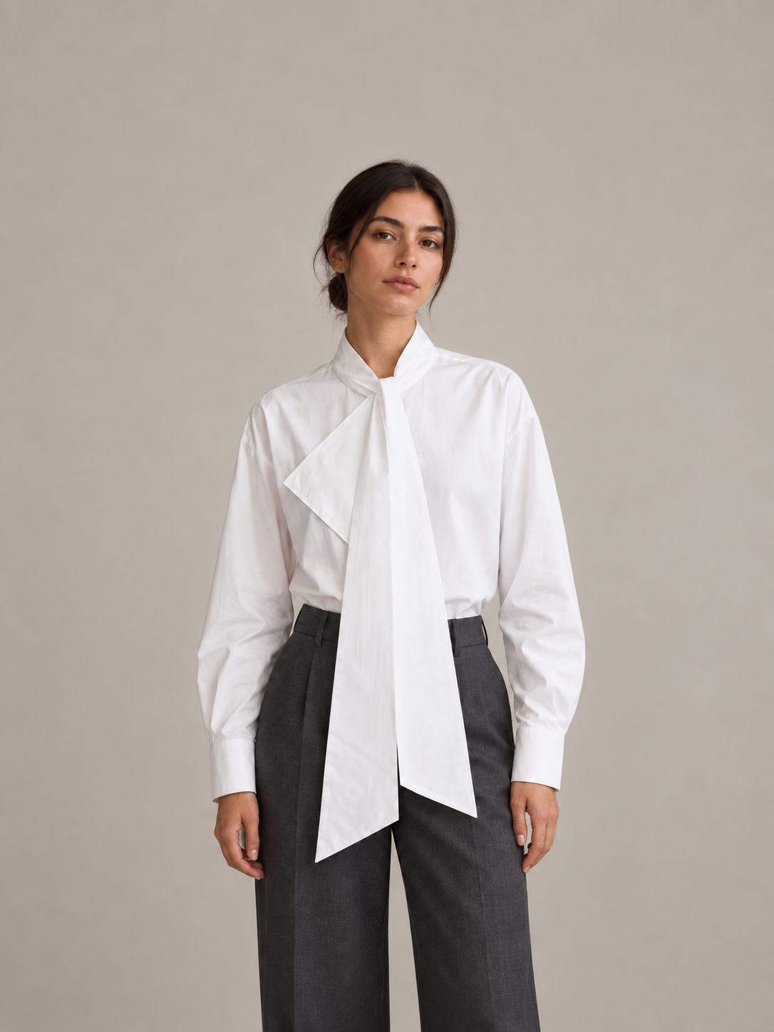 White cotton tie-collar shirt, front styling view tucked into trousers.