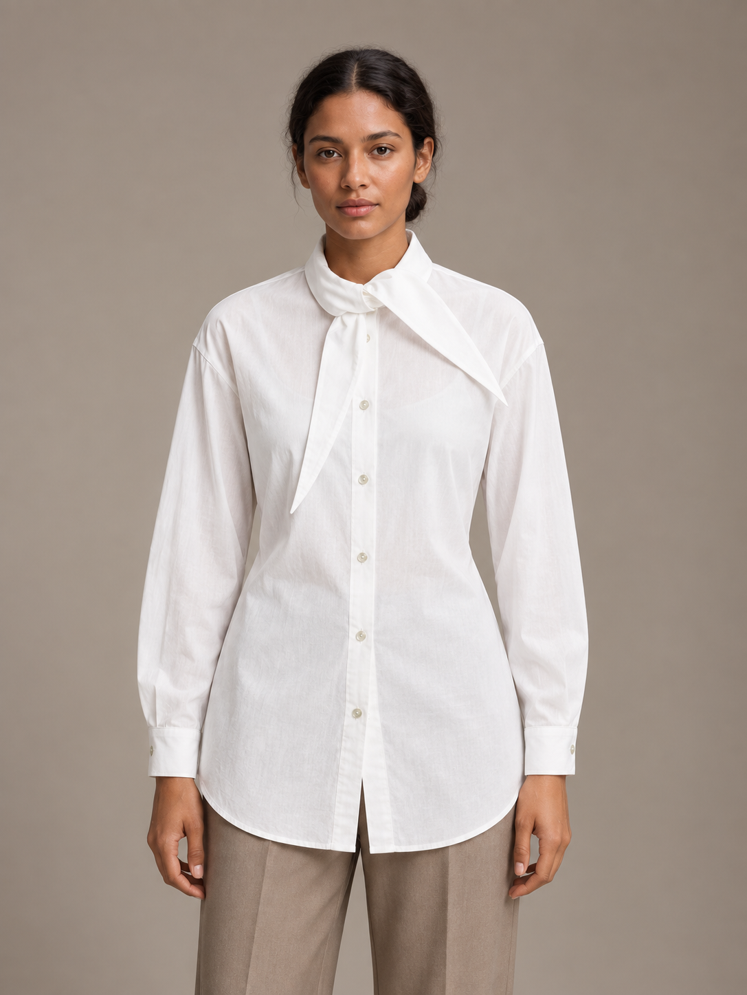 White tie-neck button-front shirt, model front.