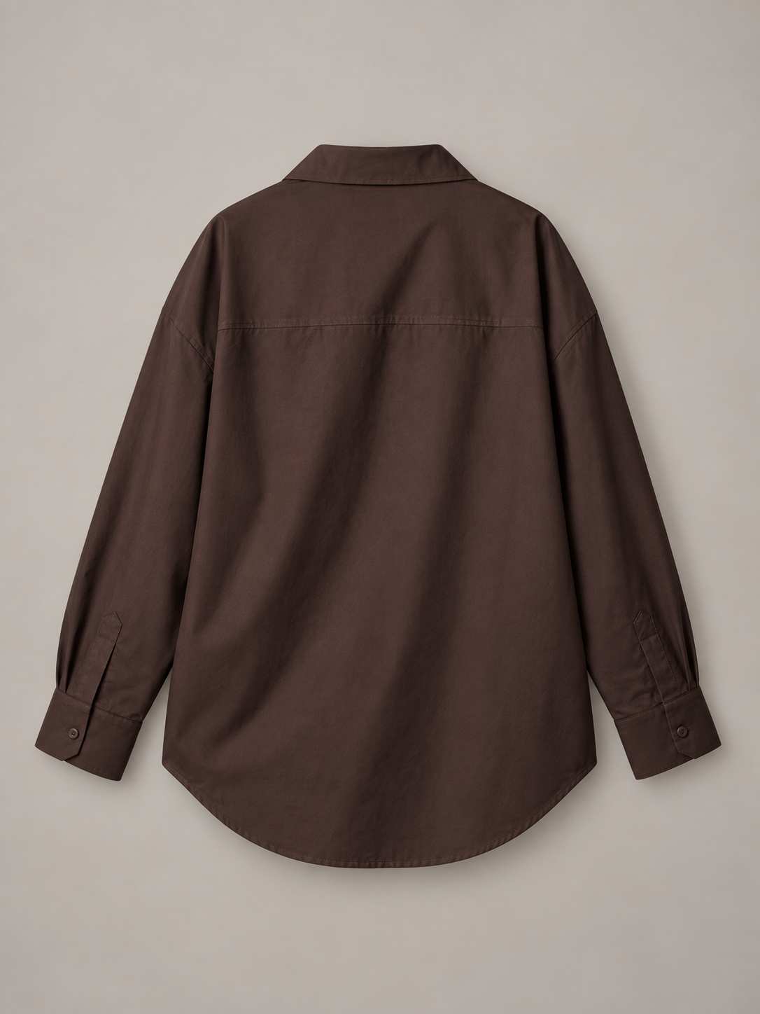 Chocolate brown oversized button-up shirt, flat back showing the shoulder yoke and curved hem.