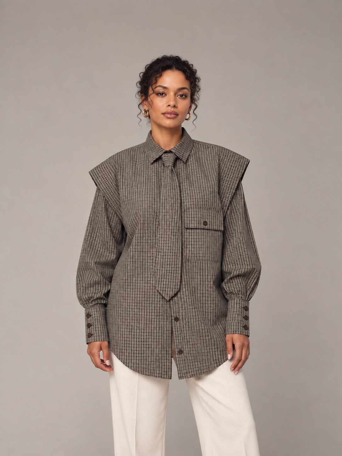 Coffee Brown plaid tie-neck shirt with folded shoulders, model front.