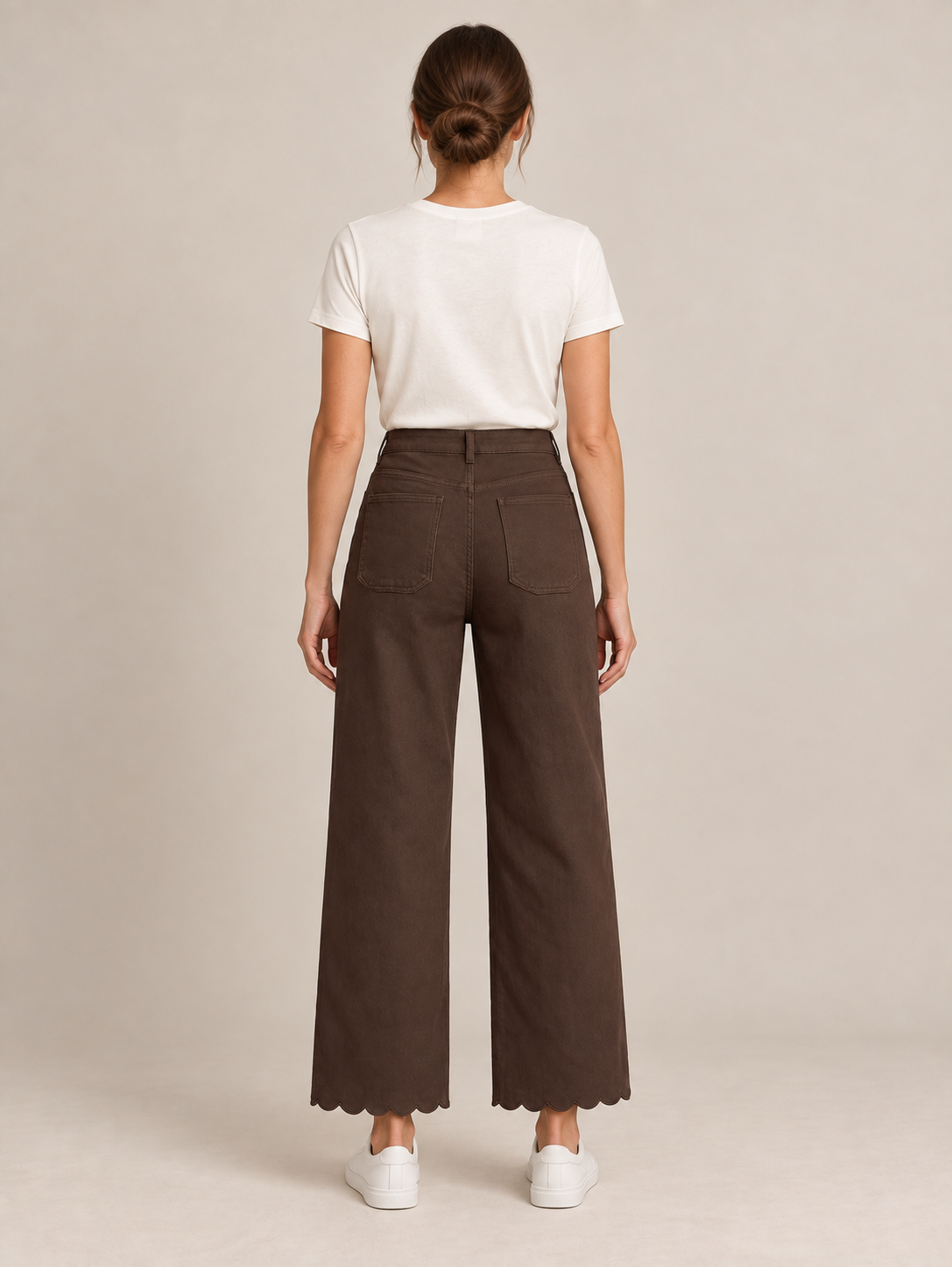 Brown scalloped-hem jeans with two rear patch pockets, back view on a model.