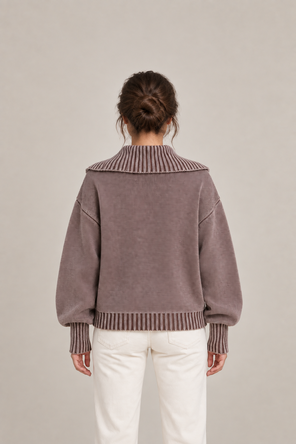 Brown washed cotton polo sweater, back view on a model showing plain knit and ribbed collar.