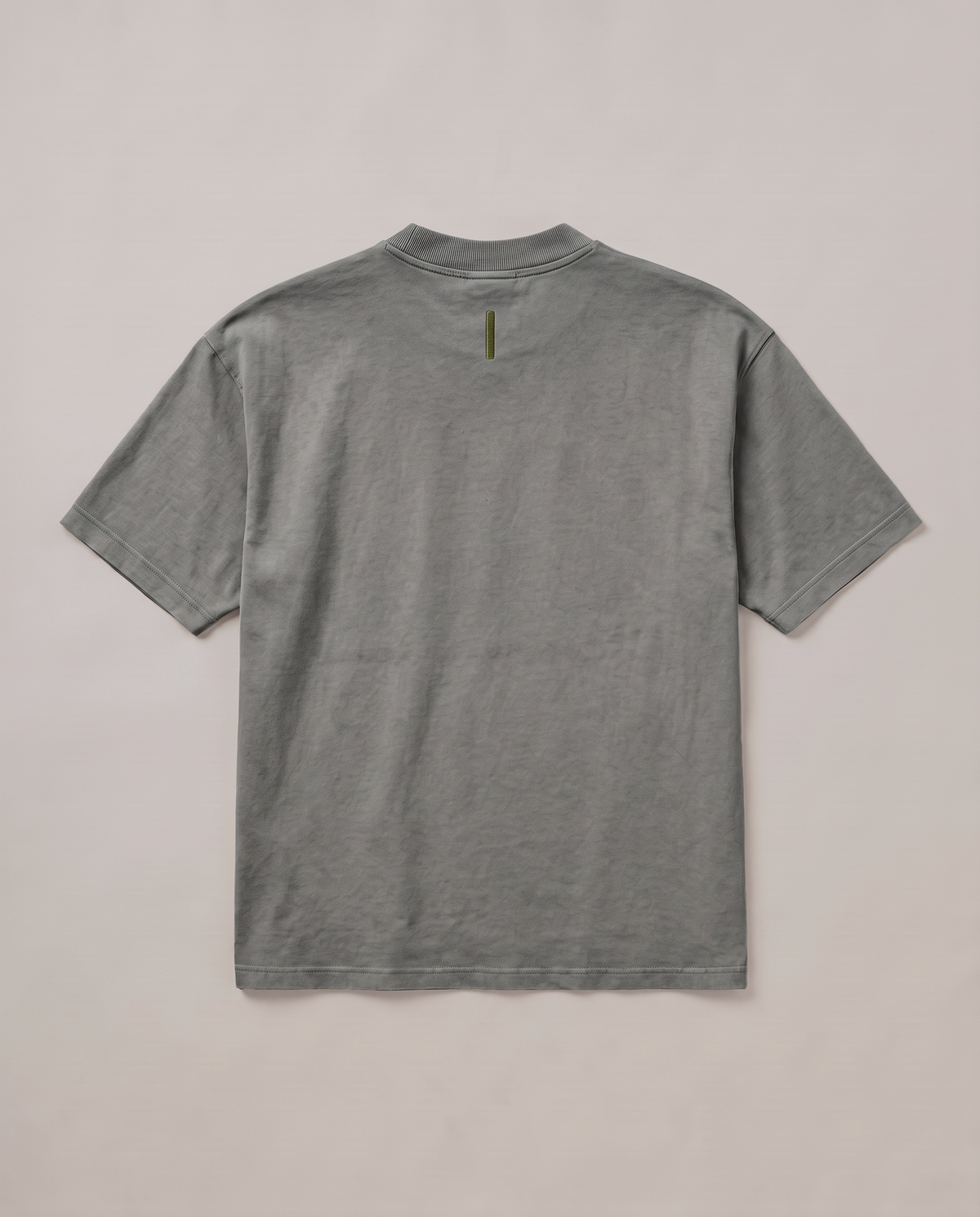 Quiet Arc T-shirt flat lay back in washed graphite with an olive back-neck bar