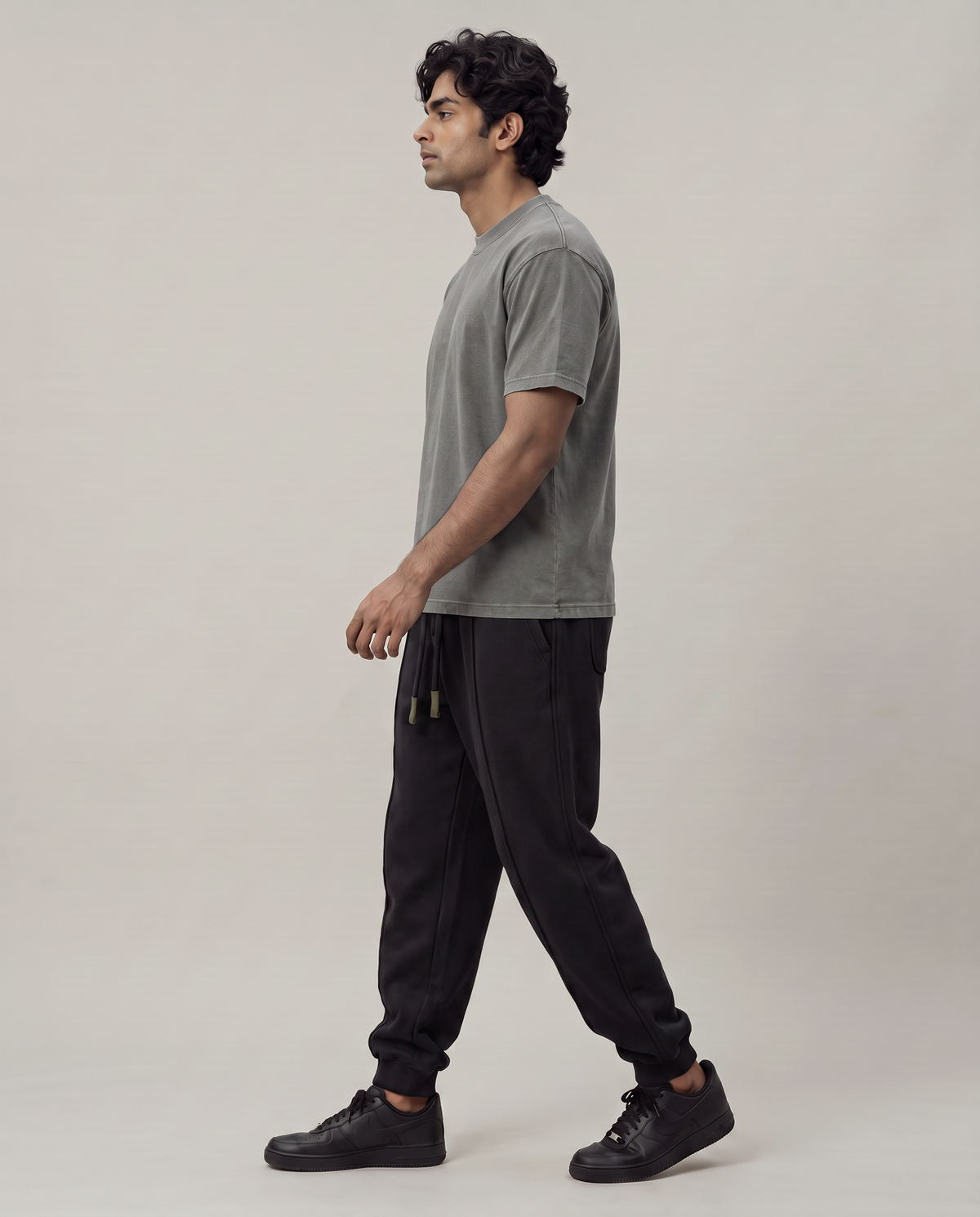 Quiet Arc T-shirt side view on model in washed graphite