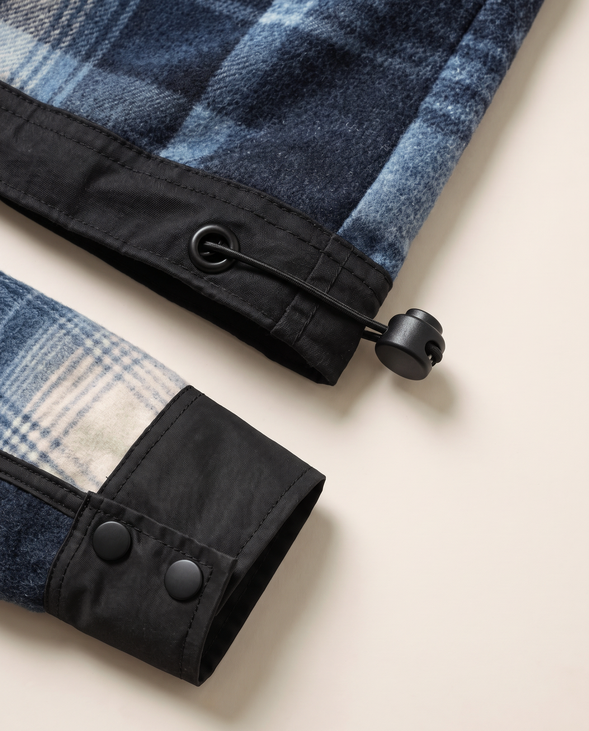 Annex Plaid Overshirt — Blue cuff and hem cordlock close-up