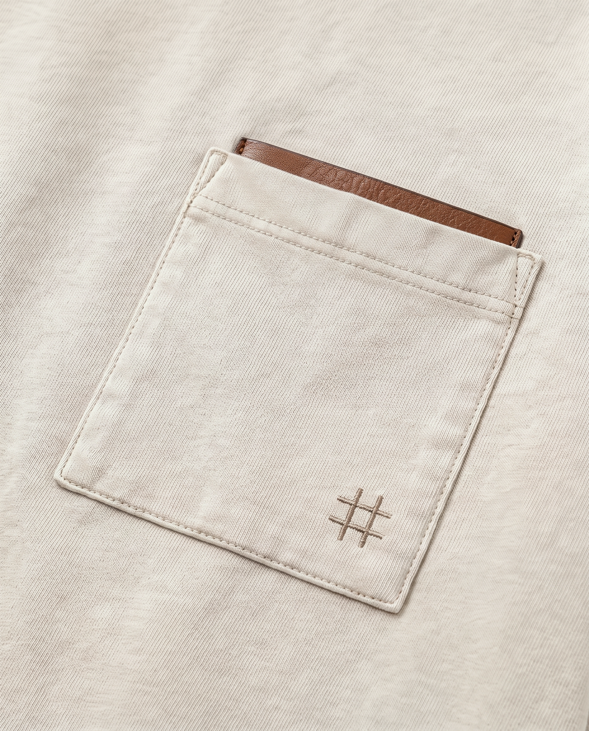 Field Note T-shirt square chest pocket with warm-neutral reveal and tonal hash mark close-up