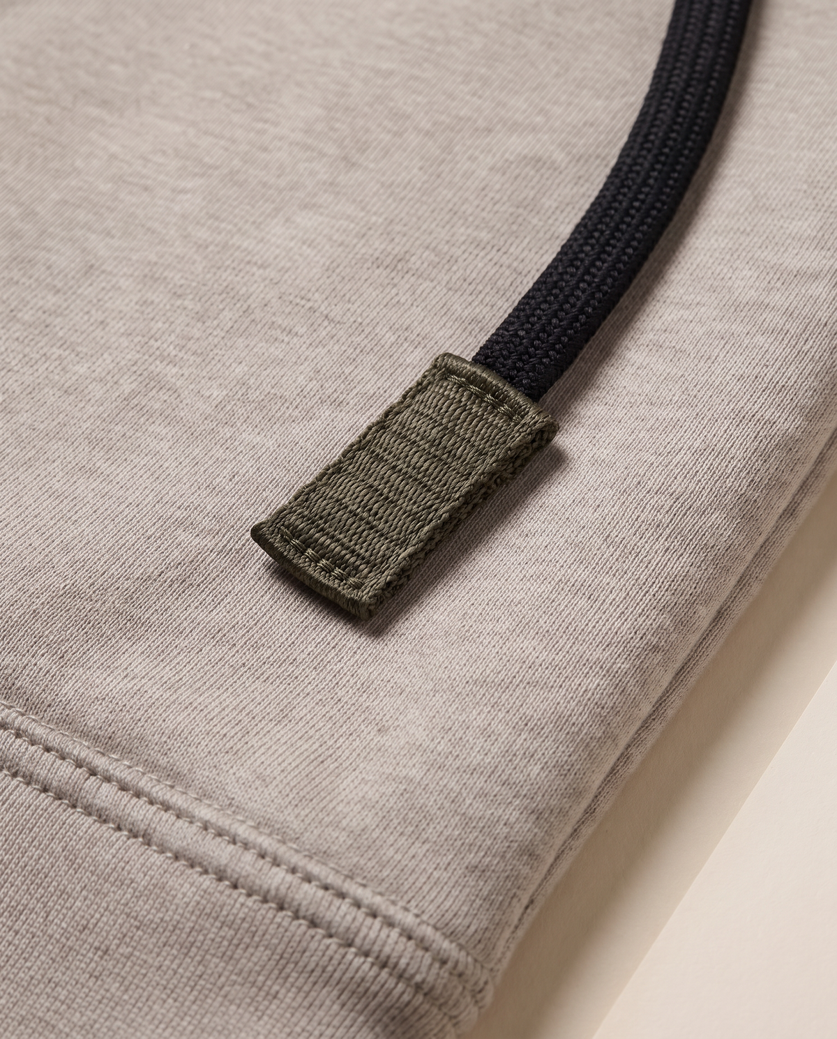 Hutton Cotton & Merino Panelled Hoodie — black drawcord and olive tab detail