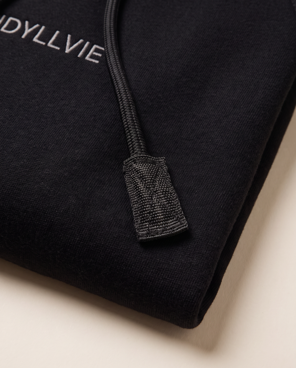 Hutton Denim Panelled Hoodie — black drawcord and fabric-tab detail