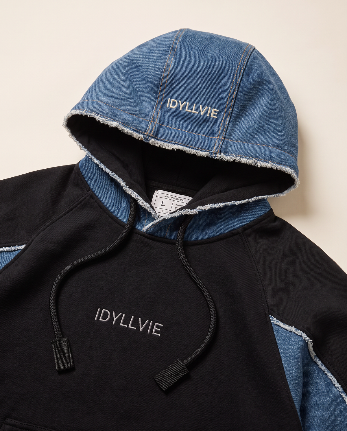 Hutton Denim Panelled Hoodie — denim hood embroidery and raw-edge detail