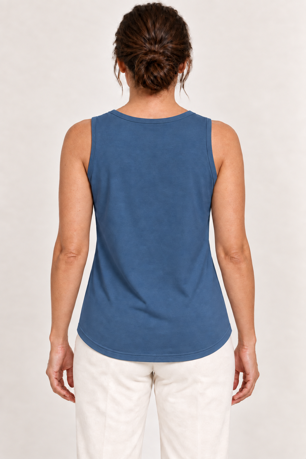 Blue cotton-stretch round-neck tank, model back.