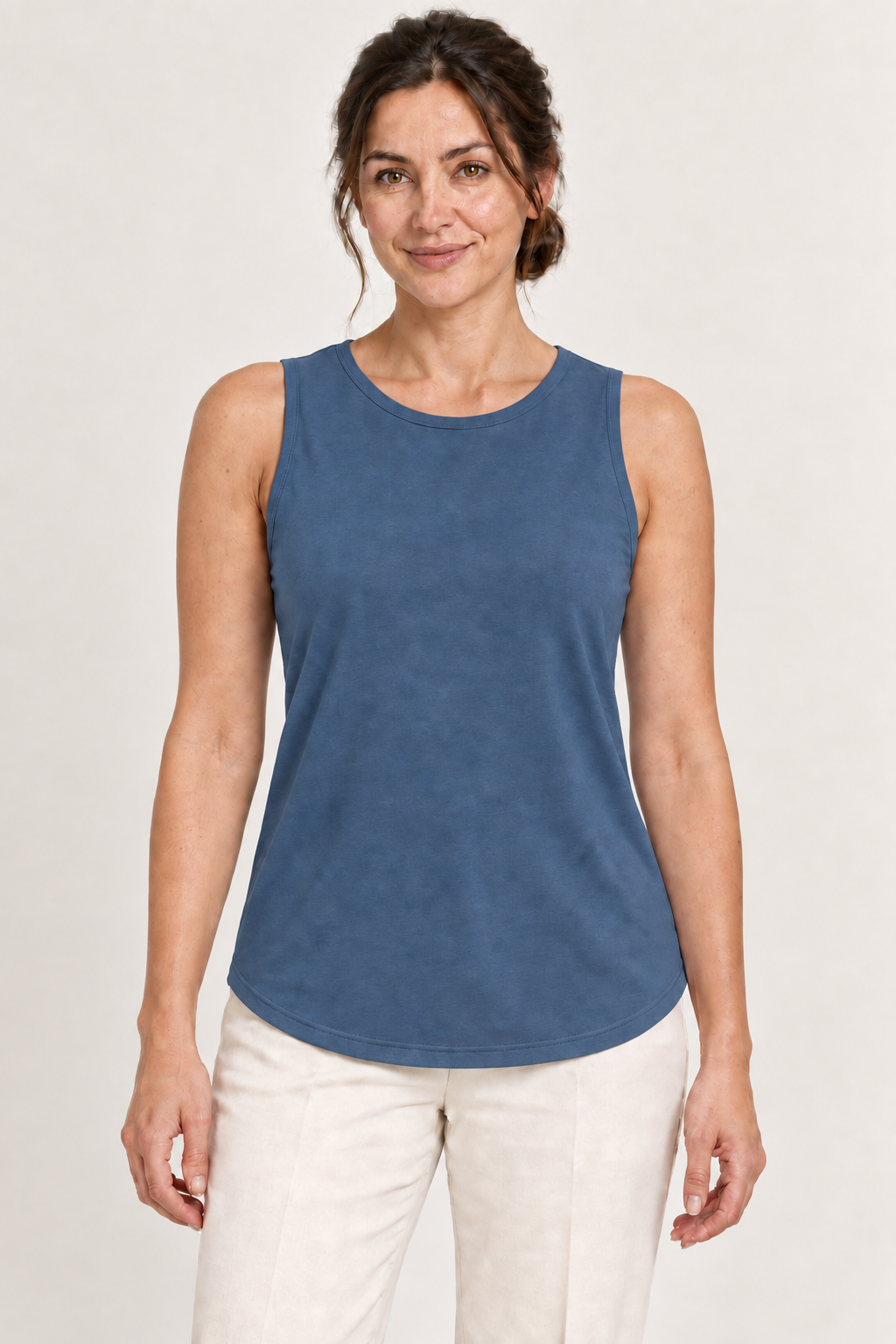 Blue cotton-stretch round-neck tank, model front.