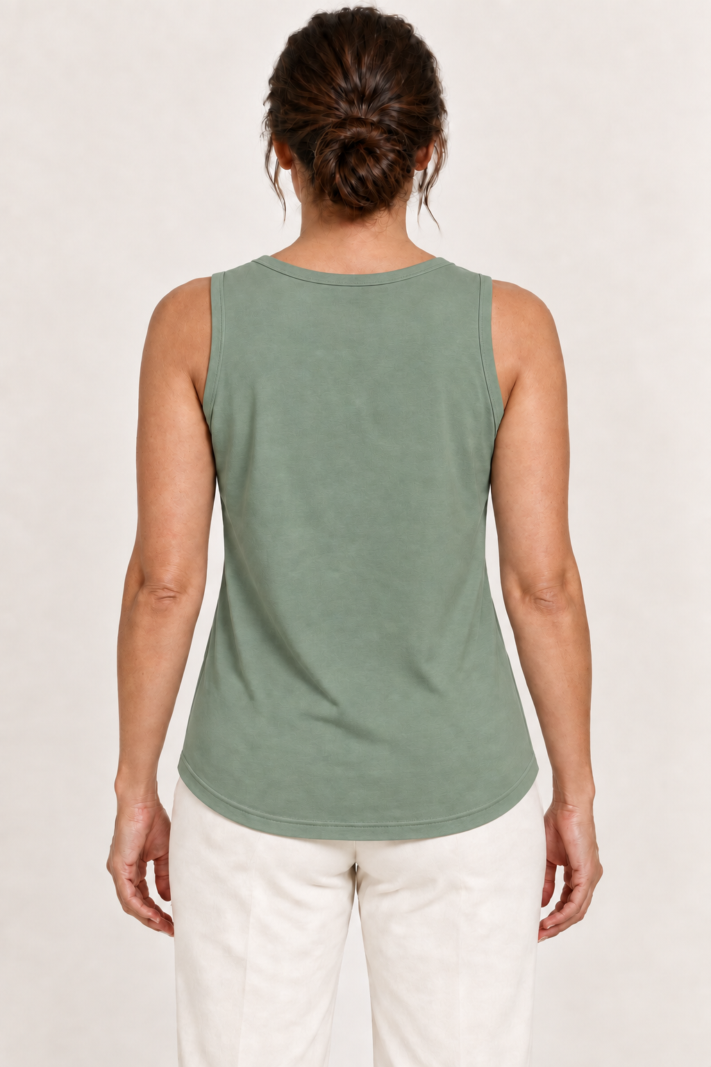 Sage green cotton-stretch round-neck tank, model back.