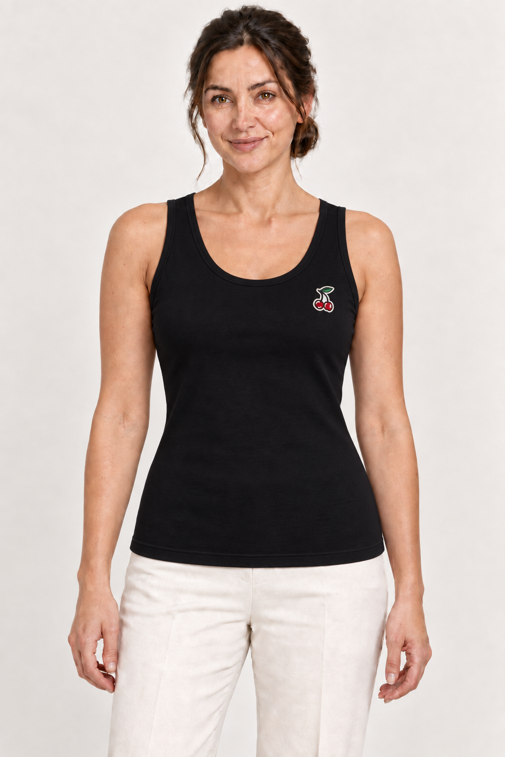 Black cotton-stretch tank top with cherry embroidery, model front