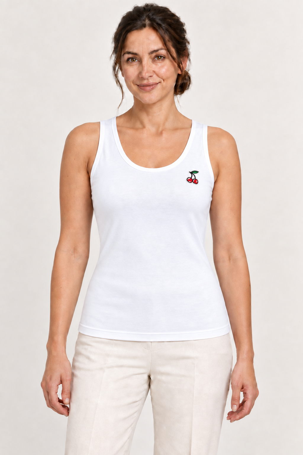 White cotton-stretch tank top with cherry embroidery, model front