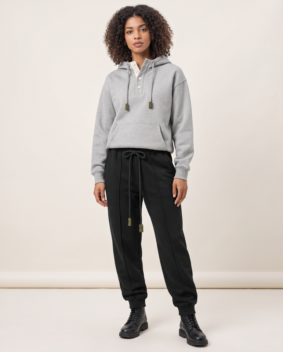 Mercer Pleated Sweatpants — Black, on-model front three-quarter
