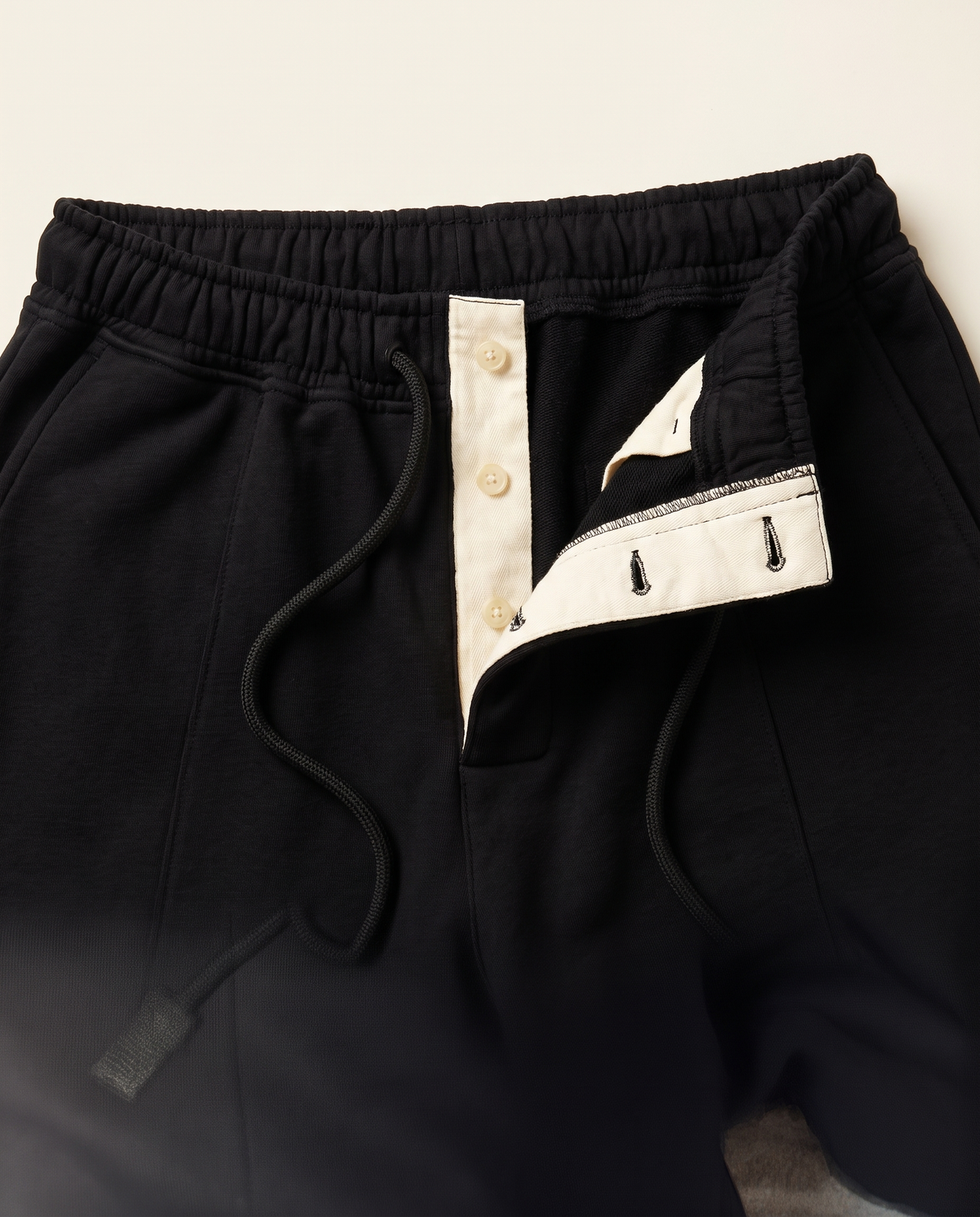Mercer Pleated Sweatpants — Black waistband and fly close-up