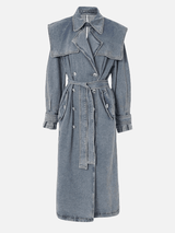 Front view of a mid-length denim trench coat featuring a belted waist, classic lapel, and raglan sleeves with button details.