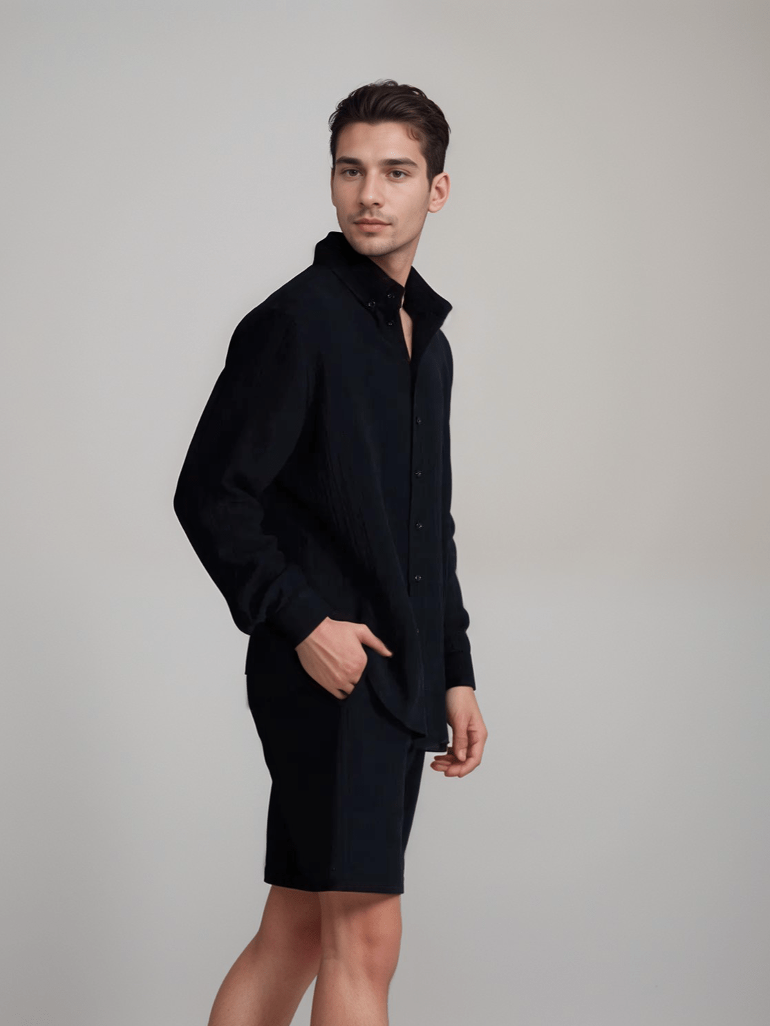 The Porterville Shorts in black 100% cotton muslin, angled product view showing drawstring waist, front pockets, cotton muslin texture