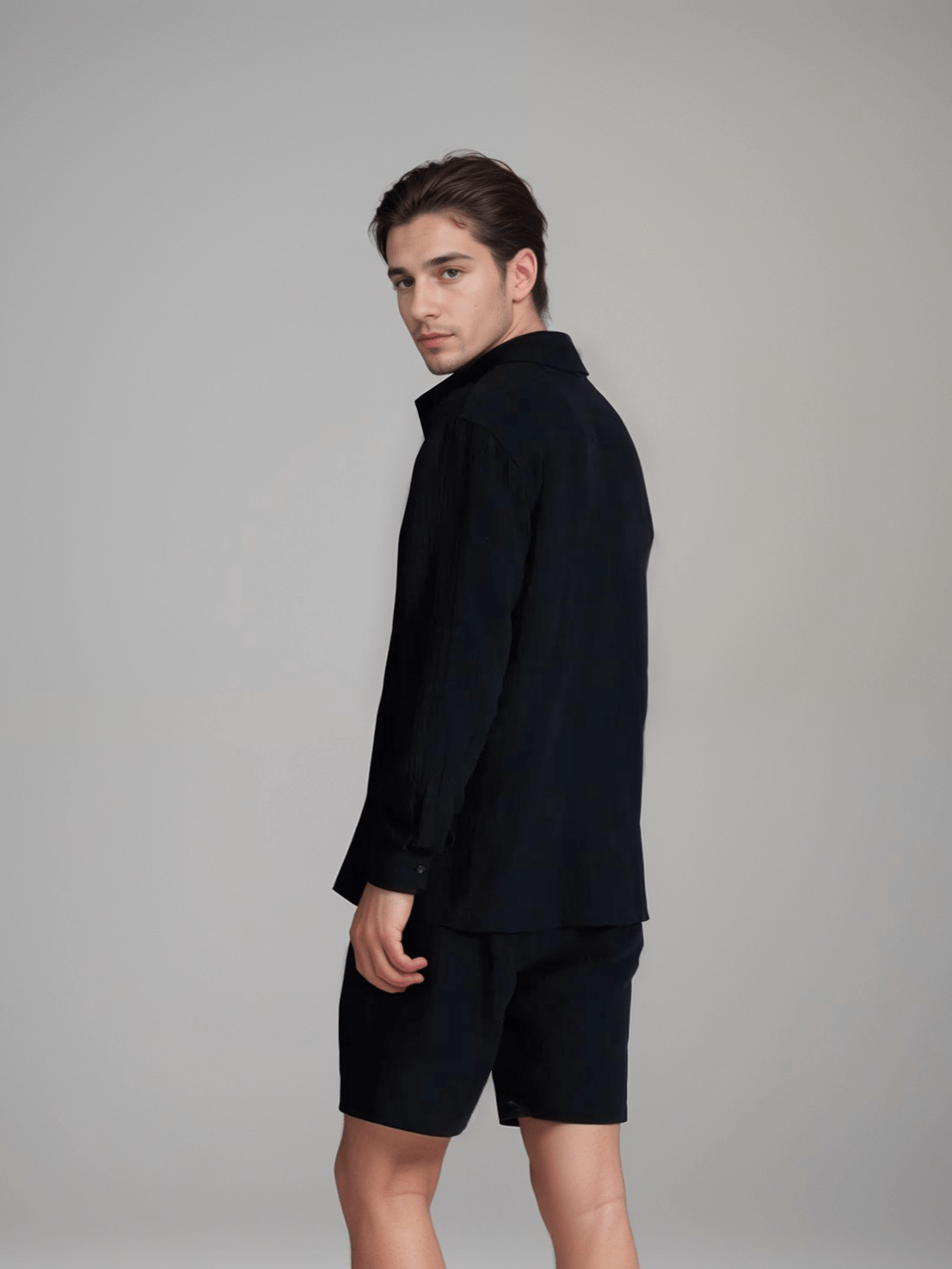 The Porterville Shorts in black 100% cotton muslin, detail product view showing drawstring waist, front pockets, cotton muslin texture