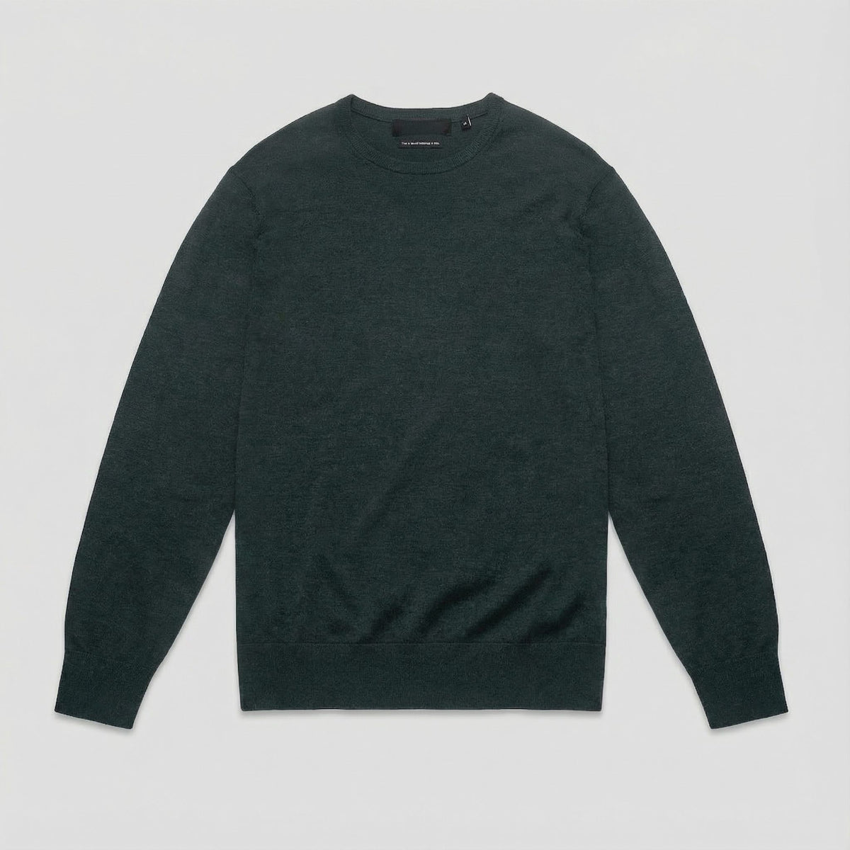 Merino Wool Crew Neck Sweater in burgundy merino wool, lifestyle view showing crew neck fit and everyday styling