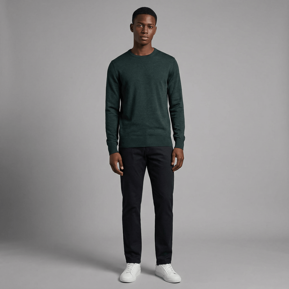 Merino Wool Crew Neck Sweater in burgundy merino wool, angled product view showing crew neck fit and everyday styling