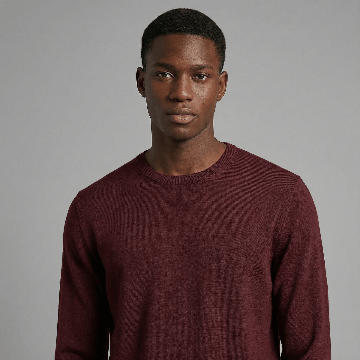 Merino Wool Crew Neck Sweater in burgundy merino wool, fit and styling view showing crew neck fit and everyday styling