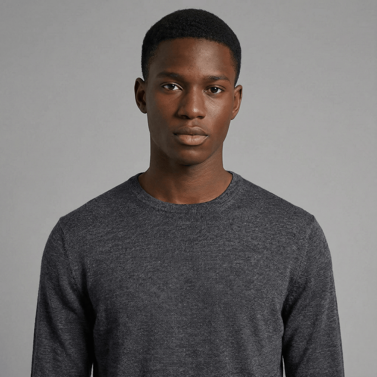 Merino Wool Crew Neck Sweater in charcoal merino wool, front product view showing crew neck fit and everyday styling
