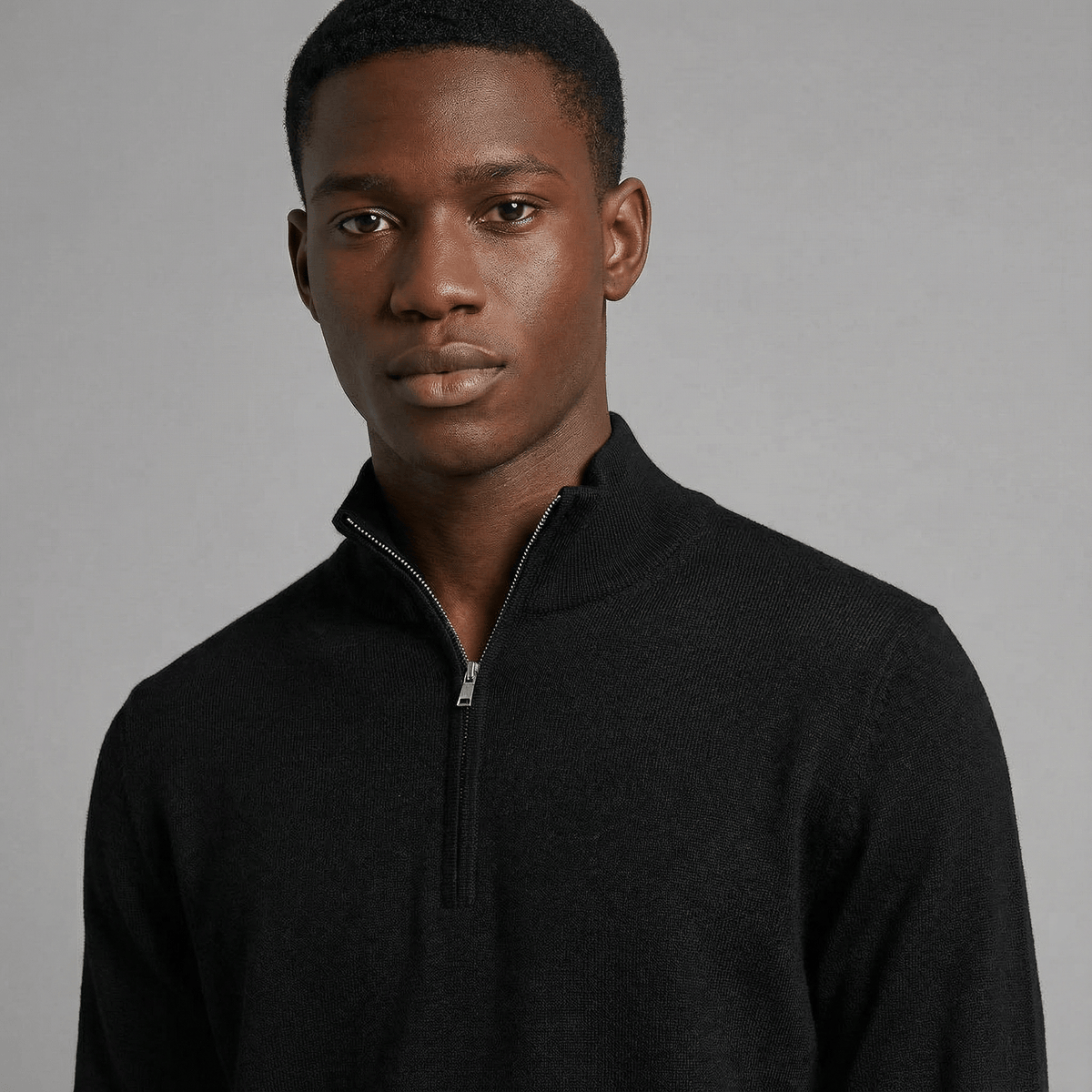 Merino Wool Quarter-Zip Sweater in black merino wool, angled product view showing product details