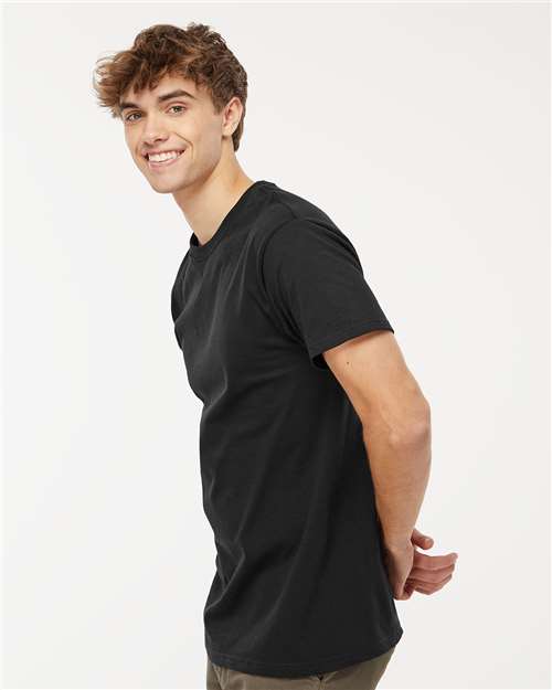 Side view of model in Men's Cotton T-Shirt - Premium Comfort Style in black. Comfortable cotton shirt for casual and active lifestyles.